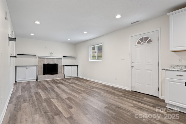 25 Southern Way, Nebo, NC 28761 - unfurnished living room featuring wood finished floors, recessed lighting, baseboards, and a fireplace