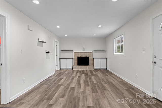 25 Southern Way, Nebo, NC 28761 - unfurnished living room with recessed lighting, a tile fireplace, wood finished floors, and baseboards