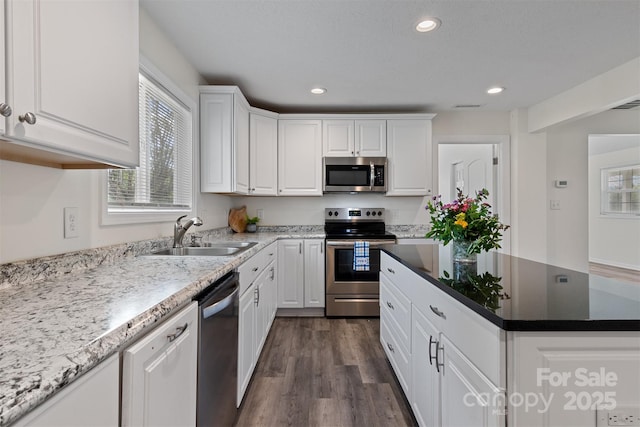25 Southern Way, Nebo, NC 28761 - kitchen with appliances with stainless steel finishes, a sink, white cabinetry, recessed lighting, and dark wood-type flooring