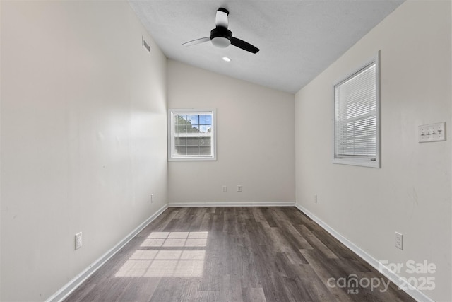 25 Southern Way, Nebo, NC 28761 - spare room featuring vaulted ceiling, dark wood-style flooring, ceiling fan, and baseboards