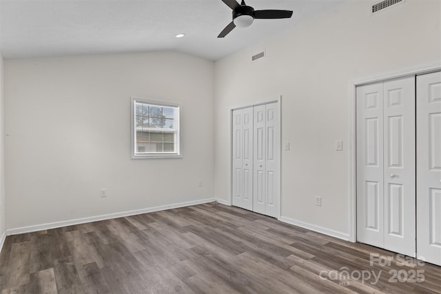 25 Southern Way, Nebo, NC 28761 - unfurnished bedroom featuring two closets, wood finished floors, baseboards, high vaulted ceiling, and a ceiling fan