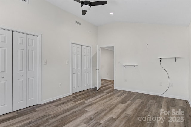 25 Southern Way, Nebo, NC 28761 - unfurnished bedroom featuring two closets, wood finished floors, baseboards, high vaulted ceiling, and recessed lighting