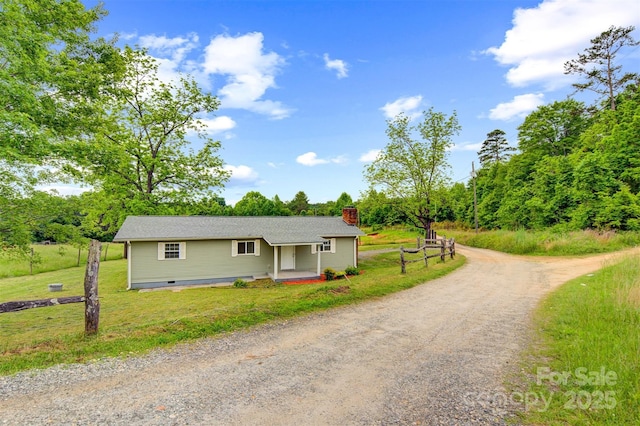 25 Southern Way, Nebo, NC 28761 - view of front of house featuring a chimney, dirt driveway, and a front lawn