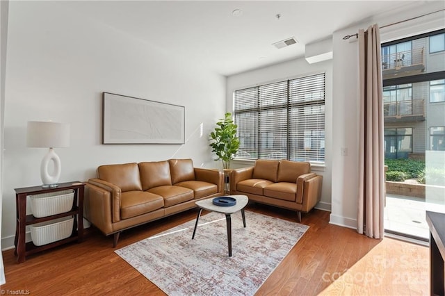 810 W 4th St Unit 201, Winston Salem, NC 27101 - living area featuring wood finished floors and baseboards