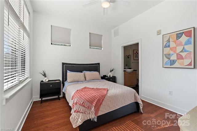 810 W 4th St Unit 201, Winston Salem, NC 27101 - bedroom featuring wood finished floors, baseboards, connected bathroom, and ceiling fan