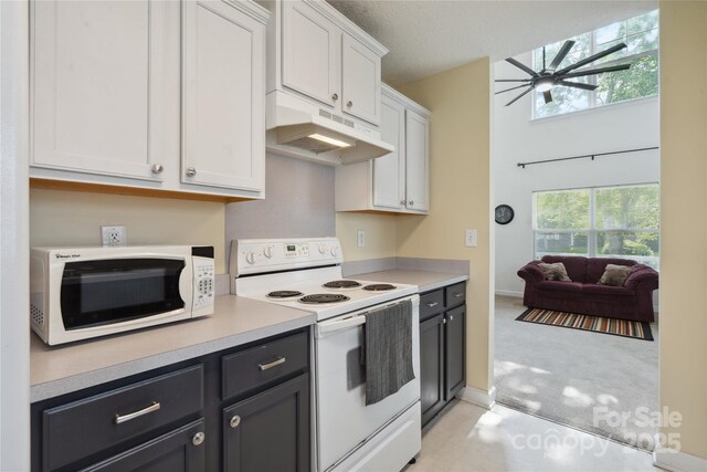 1457 Matthew Allen Cir, Kannapolis, NC 28081 - kitchen featuring white appliances, under cabinet range hood, ceiling fan, light countertops, and white cabinetry