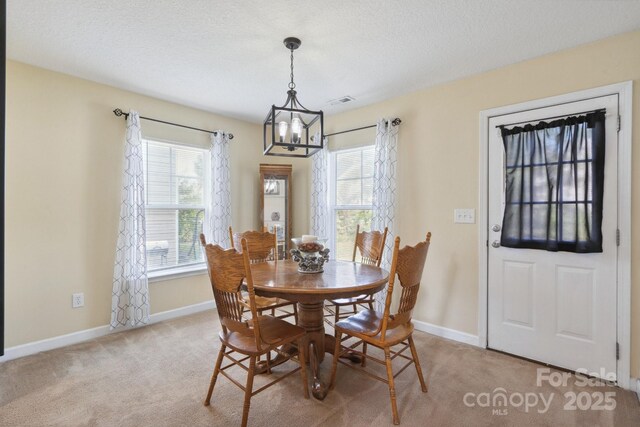 1457 Matthew Allen Cir, Kannapolis, NC 28081 - dining area featuring a chandelier, light colored carpet, and baseboards