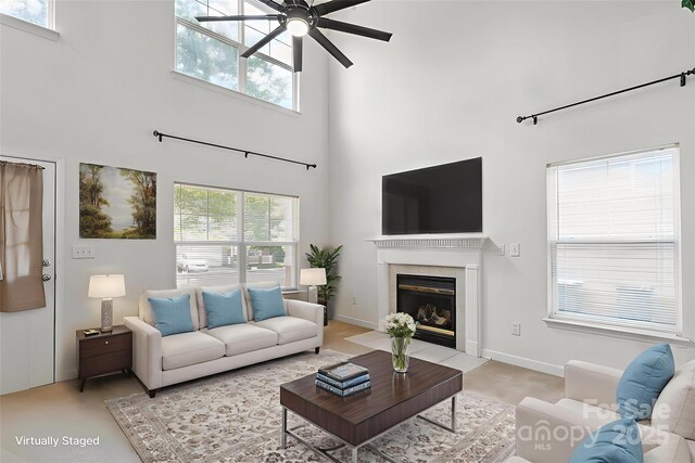 1457 Matthew Allen Cir, Kannapolis, NC 28081 - living room with a ceiling fan, a tiled fireplace, plenty of natural light, and a high ceiling