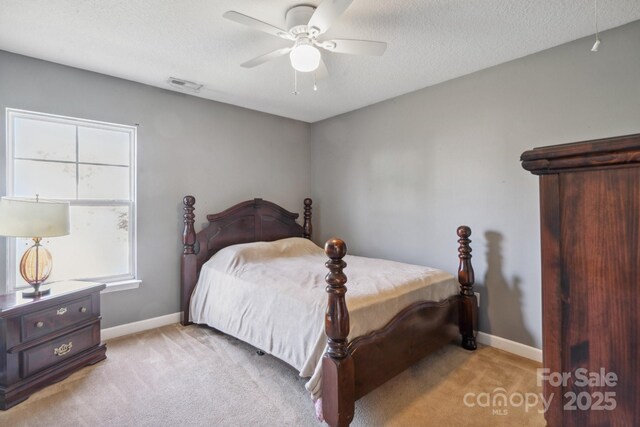 1457 Matthew Allen Cir, Kannapolis, NC 28081 - bedroom with light colored carpet, baseboards, a ceiling fan, and a textured ceiling