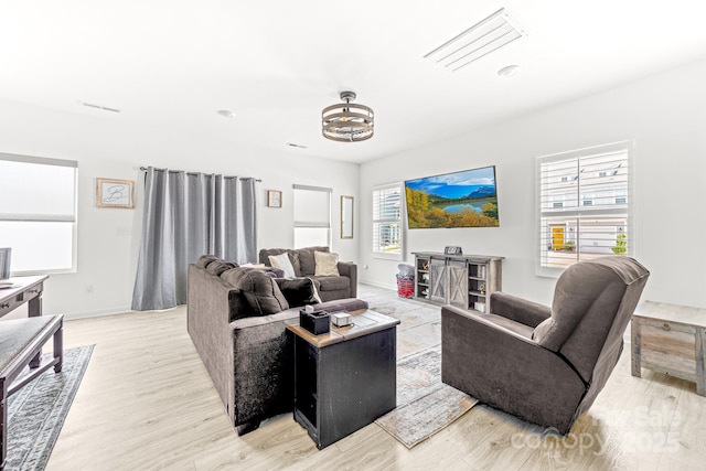 711 Bellmouth Rd, Clover, SC 29710 - living room featuring light wood finished floors, a chandelier, and baseboards