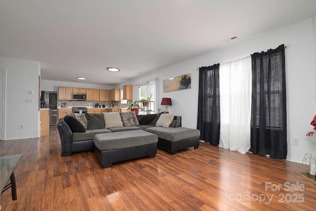 8511 Redding Glen Ave, Charlotte, NC 28216 - living room featuring dark wood-style flooring, recessed lighting, and baseboards
