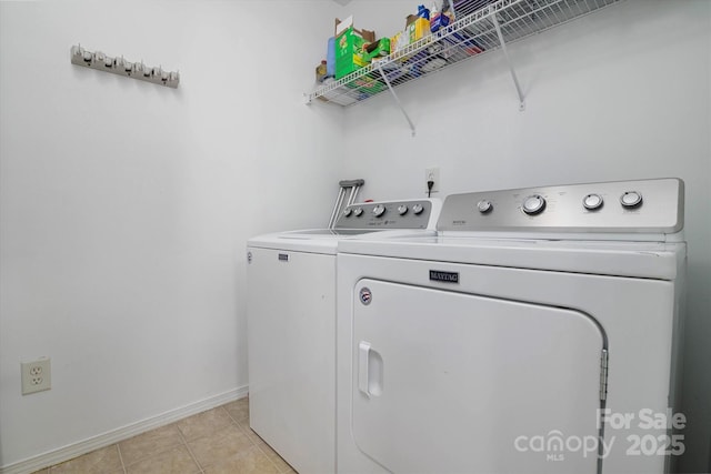8511 Redding Glen Ave, Charlotte, NC 28216 - washroom with washing machine and clothes dryer, baseboards, and light tile patterned flooring