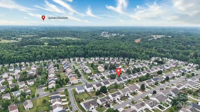 8511 Redding Glen Ave, Charlotte, NC 28216 - aerial view of property and surrounding area featuring a heavily wooded area