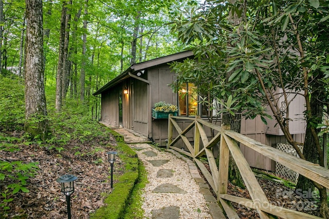 view of side of property featuring an outbuilding