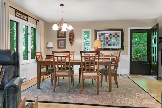 dining room featuring a chandelier and wood finished floors