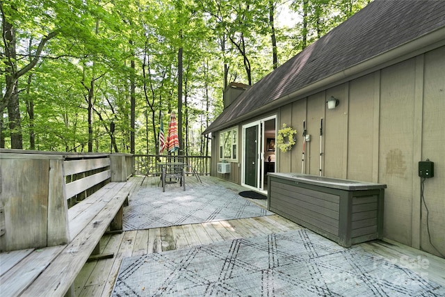 wooden terrace with outdoor dining area