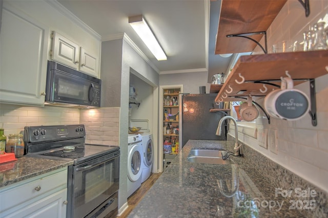 5995 Tall Tree Ln, Harrisburg, NC 28075 - kitchen with black appliances, independent washer and dryer, a sink, tasteful backsplash, and ornamental molding