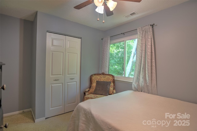 5995 Tall Tree Ln, Harrisburg, NC 28075 - bedroom featuring light colored carpet, a closet, baseboards, and ceiling fan