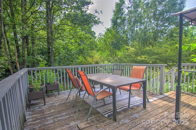 5995 Tall Tree Ln, Harrisburg, NC 28075 - wooden terrace with outdoor dining area