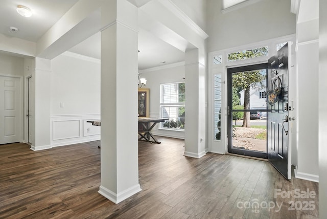2426 Tory Oak Pl, Matthews, NC 28105 - foyer with dark wood-style floors, a chandelier, and crown molding