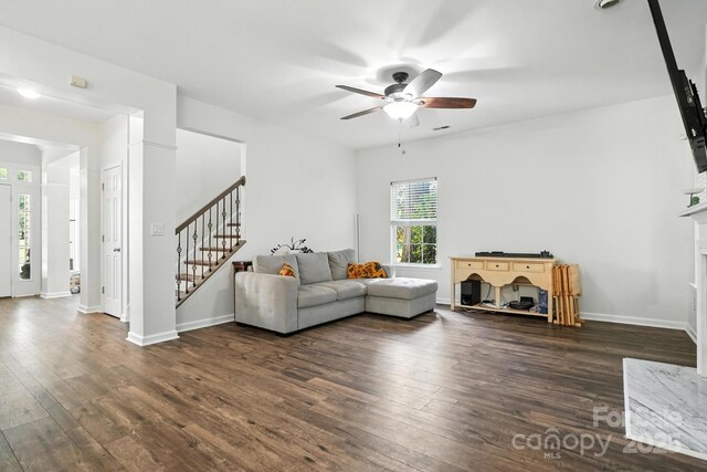 2426 Tory Oak Pl, Matthews, NC 28105 - living area featuring stairs, hardwood / wood-style flooring, a ceiling fan, and a fireplace