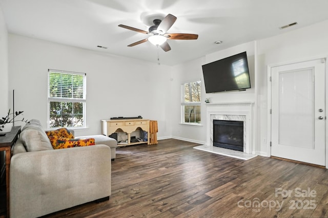 2426 Tory Oak Pl, Matthews, NC 28105 - living area featuring dark wood-type flooring, ceiling fan, and a premium fireplace
