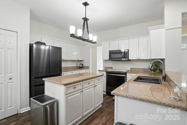 2426 Tory Oak Pl, Matthews, NC 28105 - kitchen featuring stainless steel appliances, white cabinetry, tasteful backsplash, and a kitchen island
