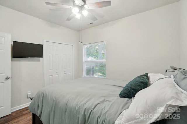 2426 Tory Oak Pl, Matthews, NC 28105 - bedroom with dark wood-type flooring, a closet, and ceiling fan