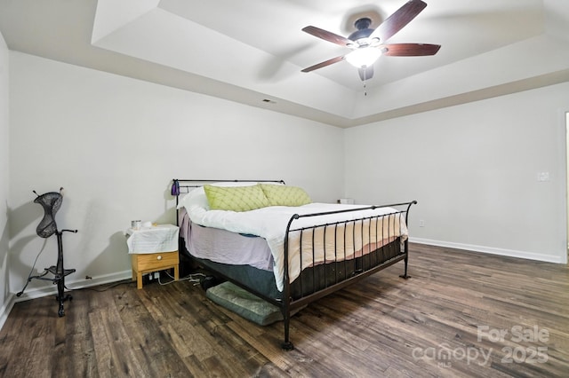 2426 Tory Oak Pl, Matthews, NC 28105 - bedroom with a raised ceiling, wood finished floors, and ceiling fan