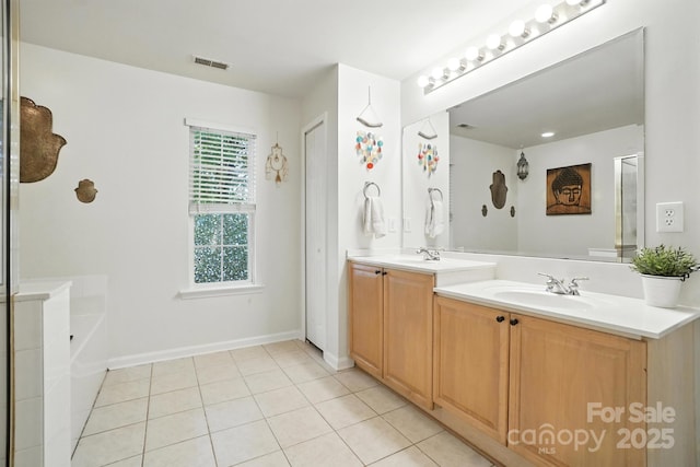 2426 Tory Oak Pl, Matthews, NC 28105 - full bathroom featuring double vanity, tile patterned flooring, a tub to relax in, and a shower