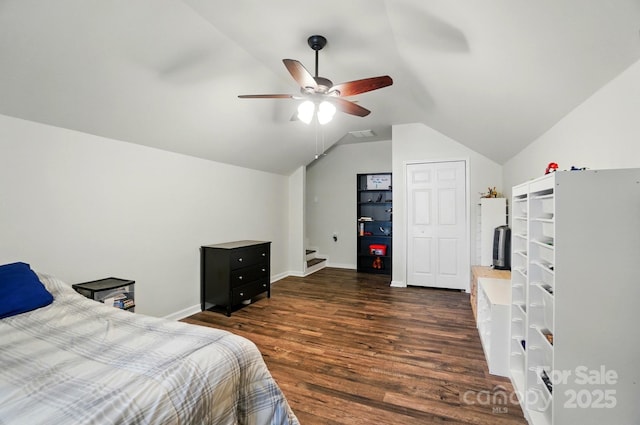 2426 Tory Oak Pl, Matthews, NC 28105 - bedroom featuring vaulted ceiling, dark wood-style floors, and a ceiling fan