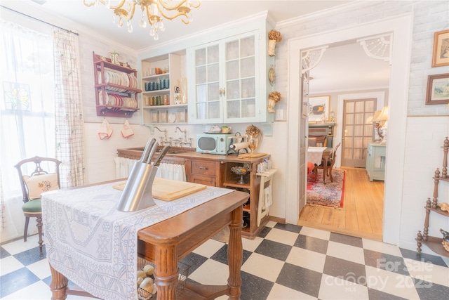 131 E Lexington Rd, Mocksville, NC 27028 - dining room with light floors, a chandelier, and ornamental molding