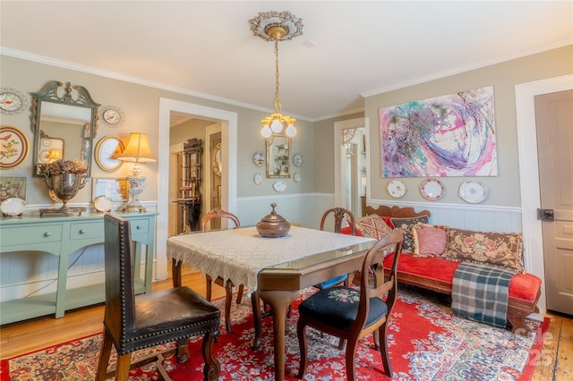 131 E Lexington Rd, Mocksville, NC 27028 - dining area featuring wood finished floors, ornamental molding, and a wainscoted wall