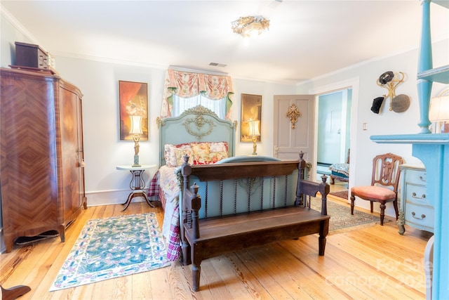 131 E Lexington Rd, Mocksville, NC 27028 - bedroom with ornamental molding, light wood-style flooring, baseboards, and a baseboard heating unit