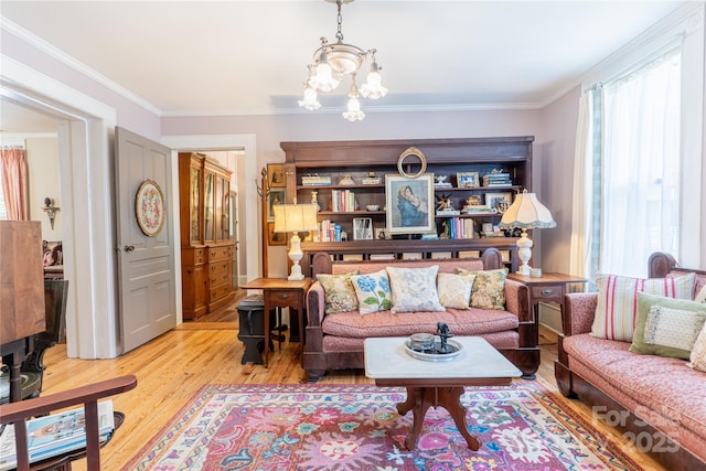 131 E Lexington Rd, Mocksville, NC 27028 - living room featuring light wood-style flooring, a chandelier, and crown molding