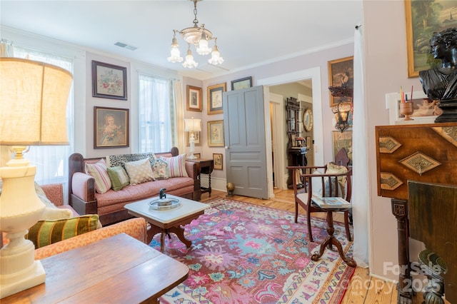 131 E Lexington Rd, Mocksville, NC 27028 - living area with a chandelier, light wood-type flooring, ornamental molding, and baseboards