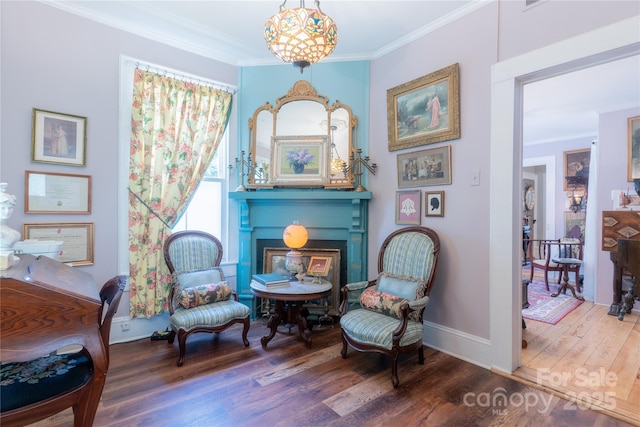 131 E Lexington Rd, Mocksville, NC 27028 - sitting room featuring a fireplace, wood finished floors, crown molding, and baseboards