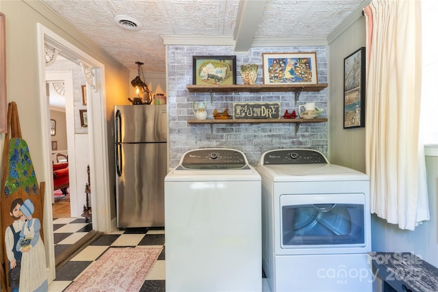 131 E Lexington Rd, Mocksville, NC 27028 - laundry room featuring crown molding, tile patterned floors, washer and dryer, and an ornate ceiling