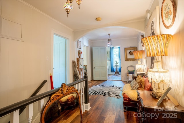 131 E Lexington Rd, Mocksville, NC 27028 - entryway featuring arched walkways, wood finished floors, a chandelier, ornamental molding, and baseboards
