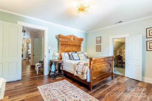 131 E Lexington Rd, Mocksville, NC 27028 - bedroom with crown molding and dark wood-style flooring