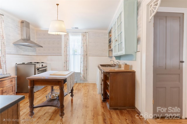 131 E Lexington Rd, Mocksville, NC 27028 - kitchen with wall chimney range hood, white gas range oven, a sink, and light wood-type flooring