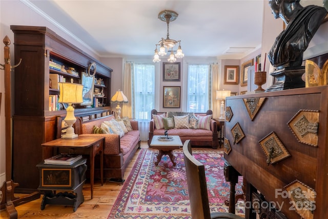 131 E Lexington Rd, Mocksville, NC 27028 - living area featuring light wood-style floors, a chandelier, and ornamental molding