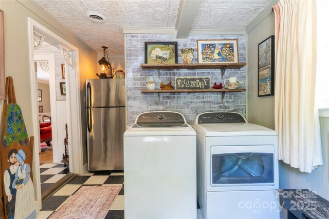 131 E Lexington Rd, Mocksville, NC 27028 - laundry area with crown molding, tile patterned floors, washer and dryer, and an ornate ceiling