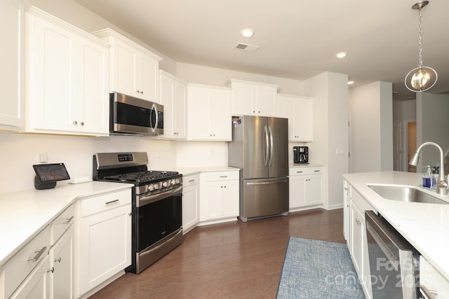 1914 Loggerhead Dr, Lancaster, SC 29720 - kitchen with appliances with stainless steel finishes, a sink, dark wood-style flooring, light countertops, and recessed lighting