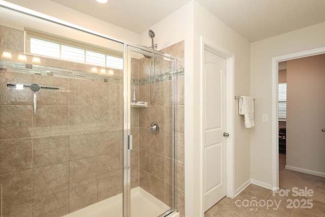 1914 Loggerhead Dr, Lancaster, SC 29720 - bathroom featuring a stall shower, healthy amount of natural light, and baseboards