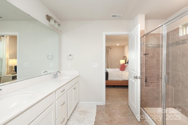 1914 Loggerhead Dr, Lancaster, SC 29720 - ensuite bathroom with a shower stall, baseboards, double vanity, and tile patterned flooring