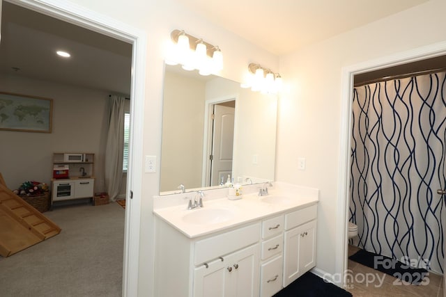 1914 Loggerhead Dr, Lancaster, SC 29720 - bathroom with double vanity, toilet, and recessed lighting