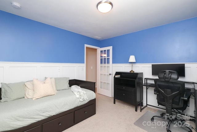 1914 Loggerhead Dr, Lancaster, SC 29720 - bedroom with an office area, light colored carpet, wainscoting, french doors, and a decorative wall