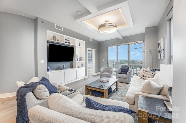 333 W Trade St Unit 1500, Charlotte, NC 28202 - living area with wood finished floors, baseboards, and beamed ceiling