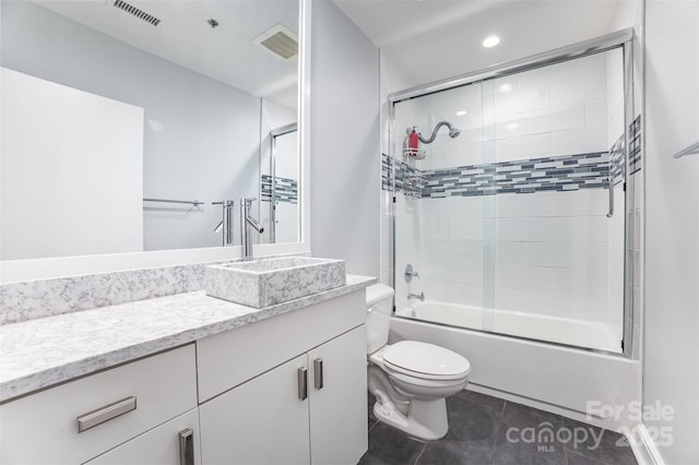333 W Trade St Unit 1500, Charlotte, NC 28202 - full bathroom with toilet, vanity, enclosed tub / shower combo, tile patterned flooring, and recessed lighting